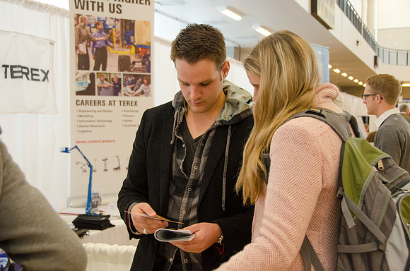 BYU-Idaho students speak to one another at a career fair held in the I-Center gym