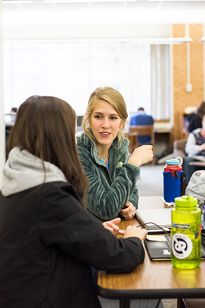 Students prepare for their classes, in the McKay Library.