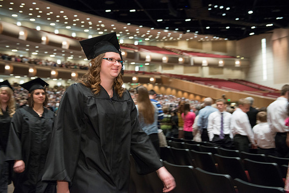 Graduates gather and march in during the processional for April 2014 Graduation ceremonies in the BYU-Idaho Center.