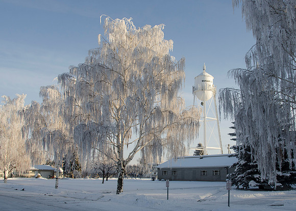 The Church of Jesus Christ of Latter Day Saints old gray church house in Sugar City, Idaho on a frosty winter day.
