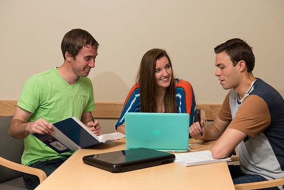Students engage in an active study group for the new housing promo pictures.