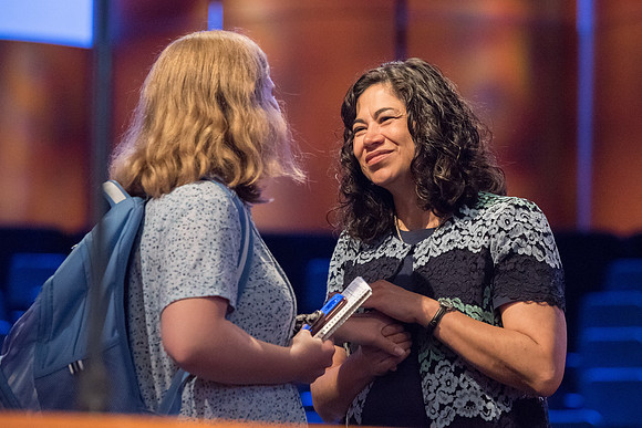 Sister Reyna Aburto interacts with students after her devotional address.