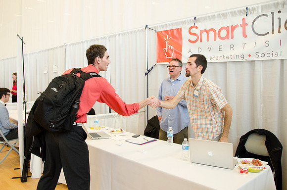 BYU-Idaho students speak to representatives from colleges or companies from their field of study at a career fair held in the I-Center gym