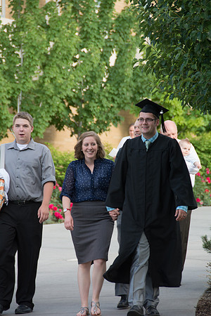 Faculty, family and graduates around campus after the commencement ceremony.
