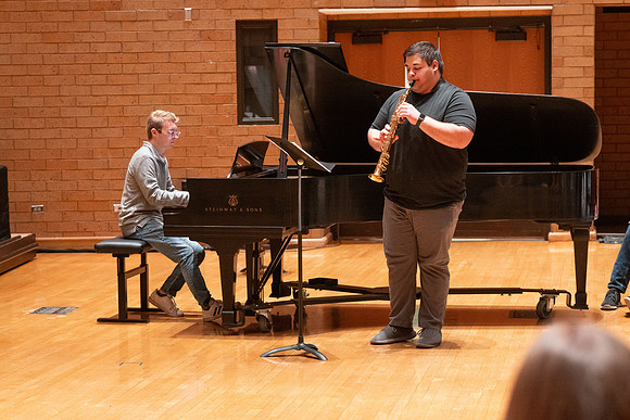 Members of the United States Marine Band work with students in a Masters class.