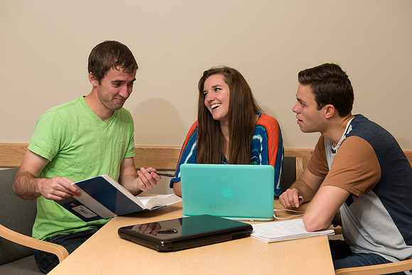 Students engage in an active study group for the new housing promo pictures.