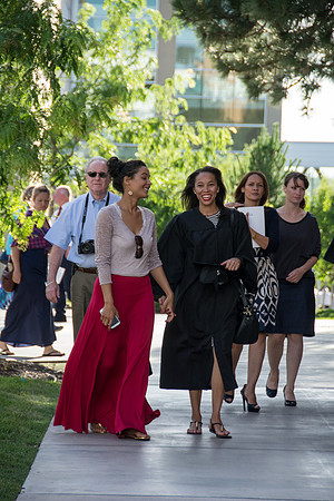 Faculty, family and graduates around campus after the commencement ceremony. Photo by Ryan Chase