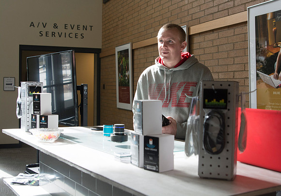 A student from the IBC program sells Audio Grenades, which is a mini-bluetooth speaker that will connect to any compatible device.