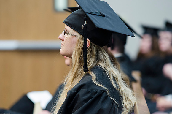 Student Graduates at the College of Education and Human Development Convocation in the HInckley Chapel.