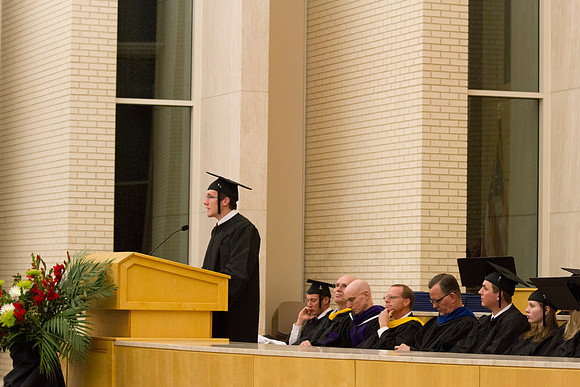 Cameron Jackson, Construction Management major, addresses his fellow graduates during Convocation in the Taylor Chapel.