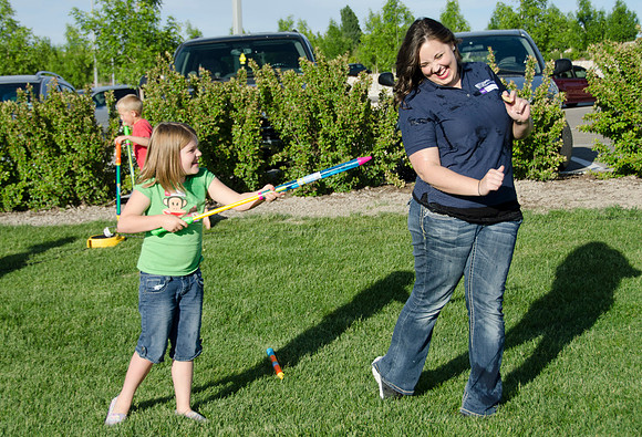 Online instructors gather with their families for an eveing of BBQ and games.