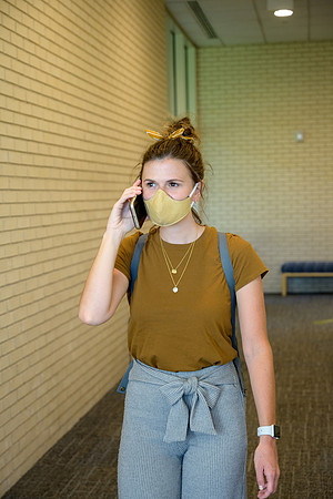 Student volunteers show the way to stay safe during this COVID 19 pandemic by social distancing, following pathway arrows and proper wearing of masks .