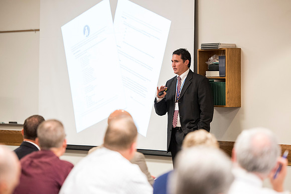 Spencer Haacke talks about students during the faculty conference.