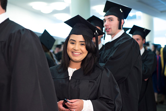 Graduates march the Processional into the I-Center. Photo by Leanna Davidson