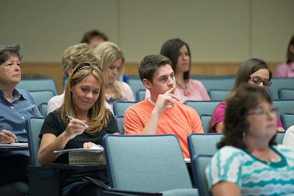 Adult participants listen to a class presented by Phil Packer.