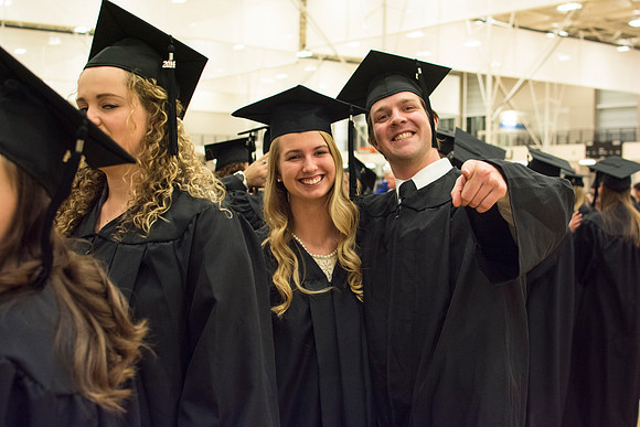 Students excited before commencement.