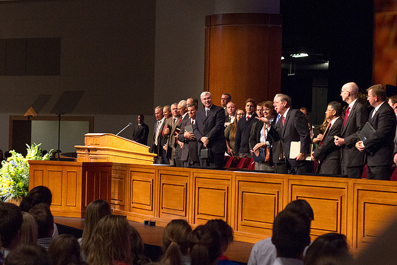 Elder Holland blows a kiss to the students and faculty as he leaves the BYU-Idaho iCenter.