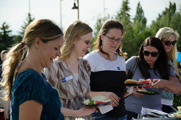Online instructors gather with their families for an eveing of BBQ and games.