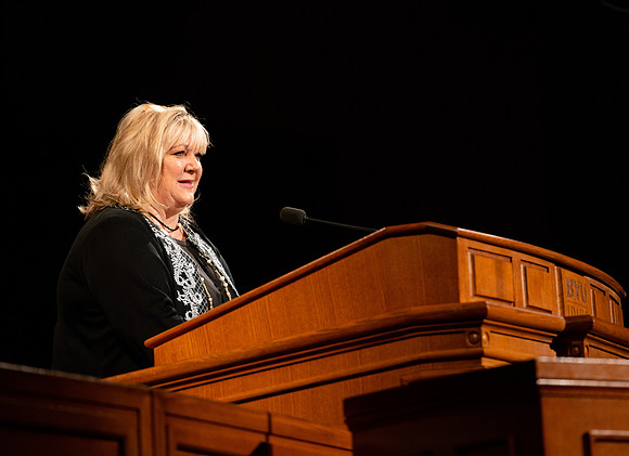 Sister Stevenson giving a speech during devotional.
