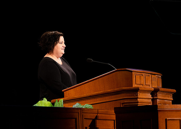 Sister Jacquel Fluckiger giving a talk during devotional.