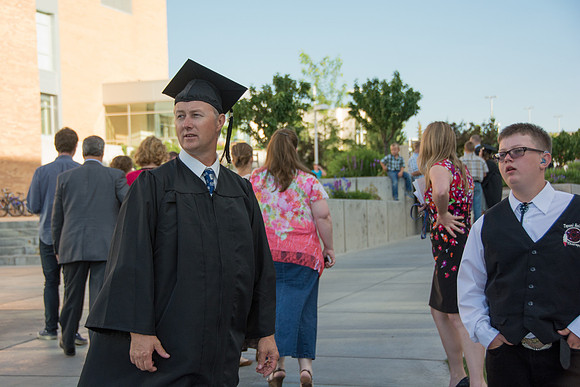 Faculty, family and graduates around campus after the commencement ceremony.