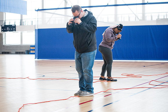 Student Support employees participate in team-building activities in the Hart Gym.