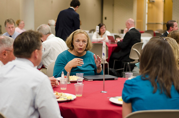 Online instructors gather for breakfast and instruction.