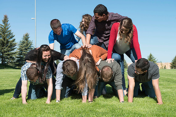 Student models interact and smile for marketing purposes that will be used for the new Campus Housing next to The Ivy.