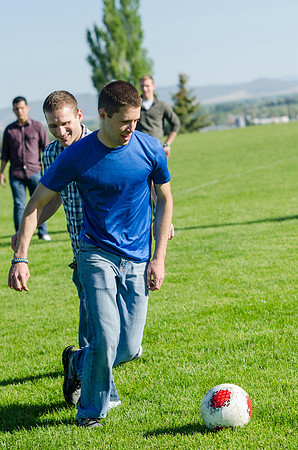 A group of students play a friendly game of soccer.