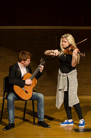 Students practice their music piece for their upcoming performance.
