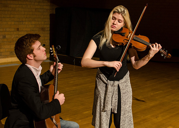 Students practice their music piece for their upcoming performance.