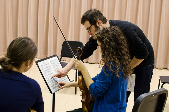 A member of the Shanghai String Quartet working with student ensembles.