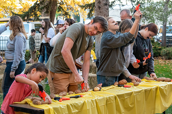 The Rexburg community celebrating the harvest of the potatoes through different activities at the Rexburg Tabernacle.