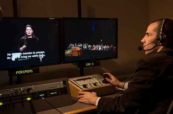 Behind the scenes of devotional: In the AV Camera Control room students run five mounted cameras in the BYU-I Center auditorium.