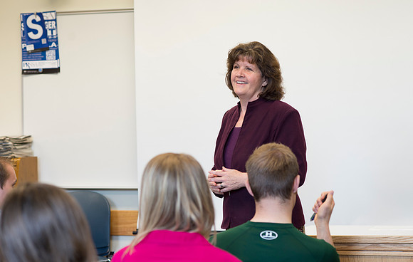 Sister Brooke McKenna teaches students in a communication class.