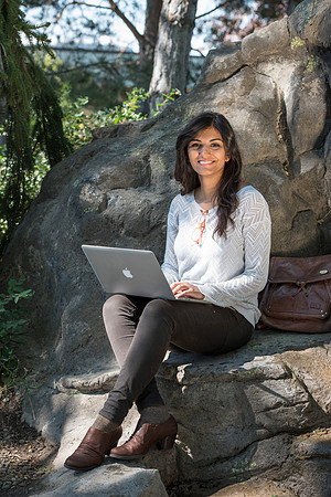 Student Noor Sofi poses in the Gardens for online learning.