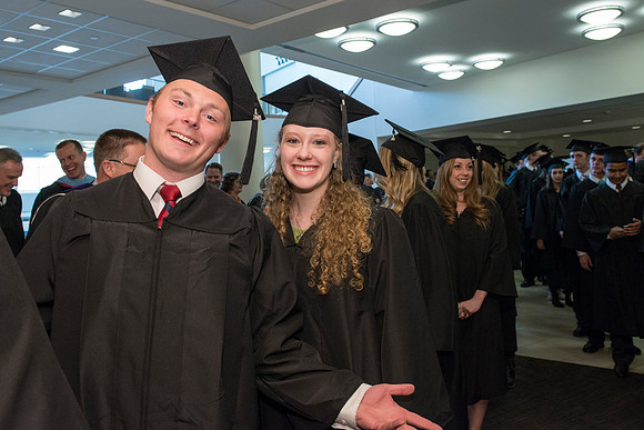 Graduates gather and march in during the processional for April 2014 Graduation ceremonies in the BYU-Idaho Center.