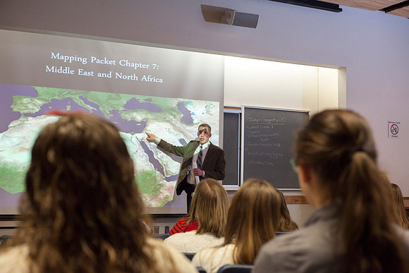 Brother Michael Madsen teaches his early morning Geography For Elementary Teachers class in the Ricks Building.