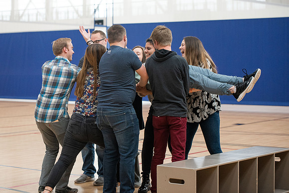 Student Support employees participate in team-building activities in the Hart Gym.