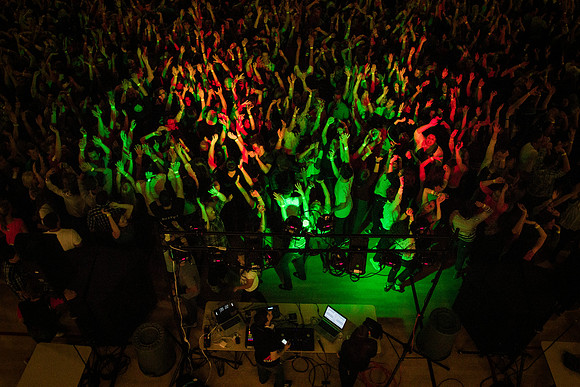Students dance in the BYU-Idaho Center at the i-Night Extravaganza.