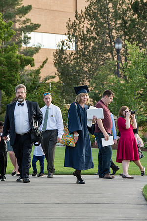 Faculty, family and graduates around campus after the commencement ceremony.