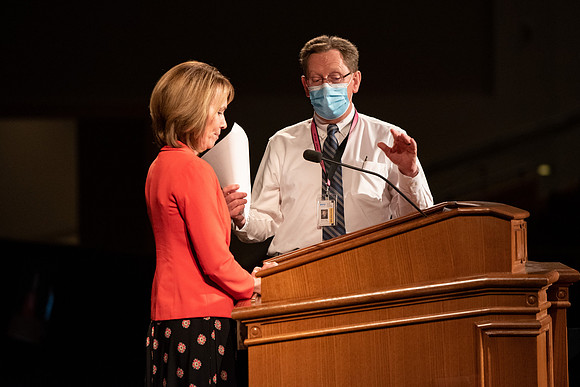 Amanda Kingsford speaks in devotional to an empty auditorium due to Covid-19 restrictions.