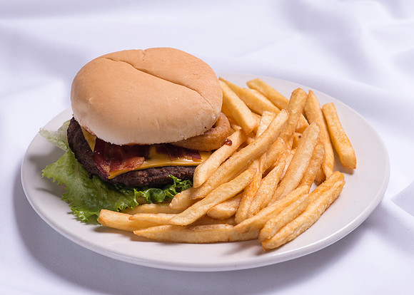 Bacon, Chesse and Onion-Ring Hamburger with Fries.
