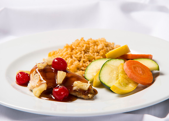 BYU-Idaho Food Service Catering menu item. Sweet and sour chicken Polynesian Chicken Dinner, with the cherries and pineapple, with rice and vegetables.