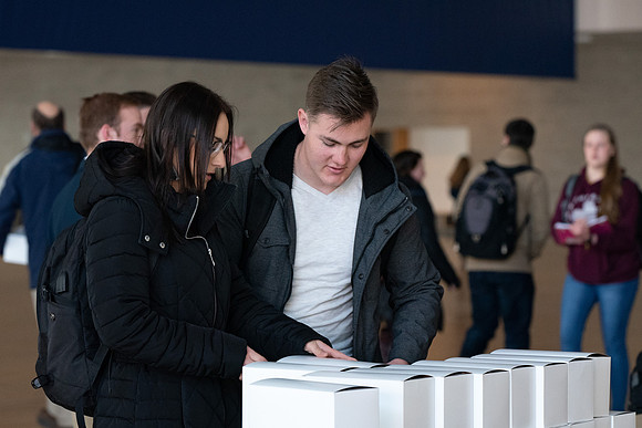 Students pick up their $2 box lunch after devotional for the first time.