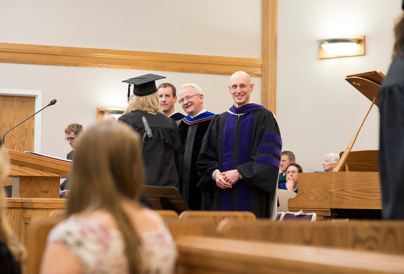 Students of the College of Human Development receive their diploma cover.