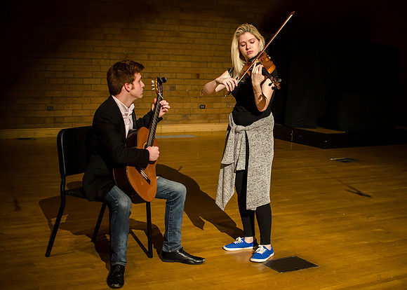 Students practice their music piece for their upcoming performance.