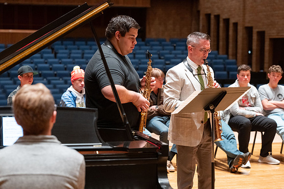Members of the United States Marine Band work with students in a Masters class.