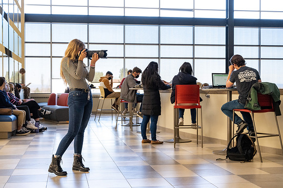 Katelyn Brown photographing devotional gathering in the MC Crossroads.