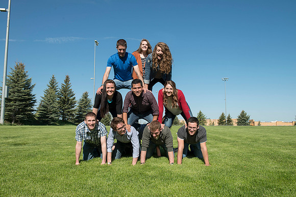 Student models interact and smile for marketing purposes that will be used for the new Campus Housing next to The Ivy.